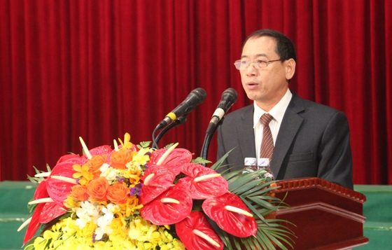 Ông Hoàng Quốc Hào, Giám đốc Sở Tư pháp Nghệ An lên đọc báo cáo kết quả triển khai