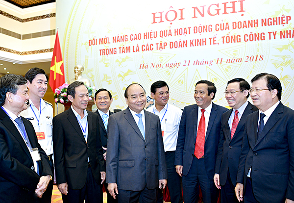 Thủ tướng Nguyễn Xuân Phúc, Phó Thủ tướng Vương Đình Huệ, Phó Thủ tướng Trịnh Đình Dũng cùng các đại biểu dự Hội nghị. Ảnh: QUANG HIẾU
