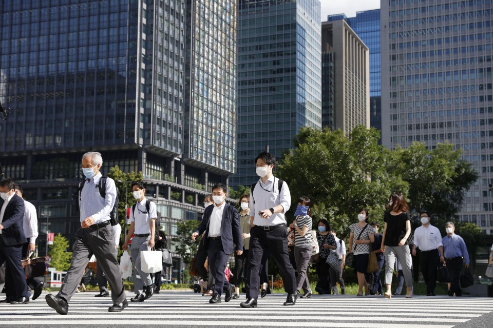Người dân đeo khẩu trang phòng dịch COVID-19 tại Tokyo (Nhật Bản), ngày 2/8.